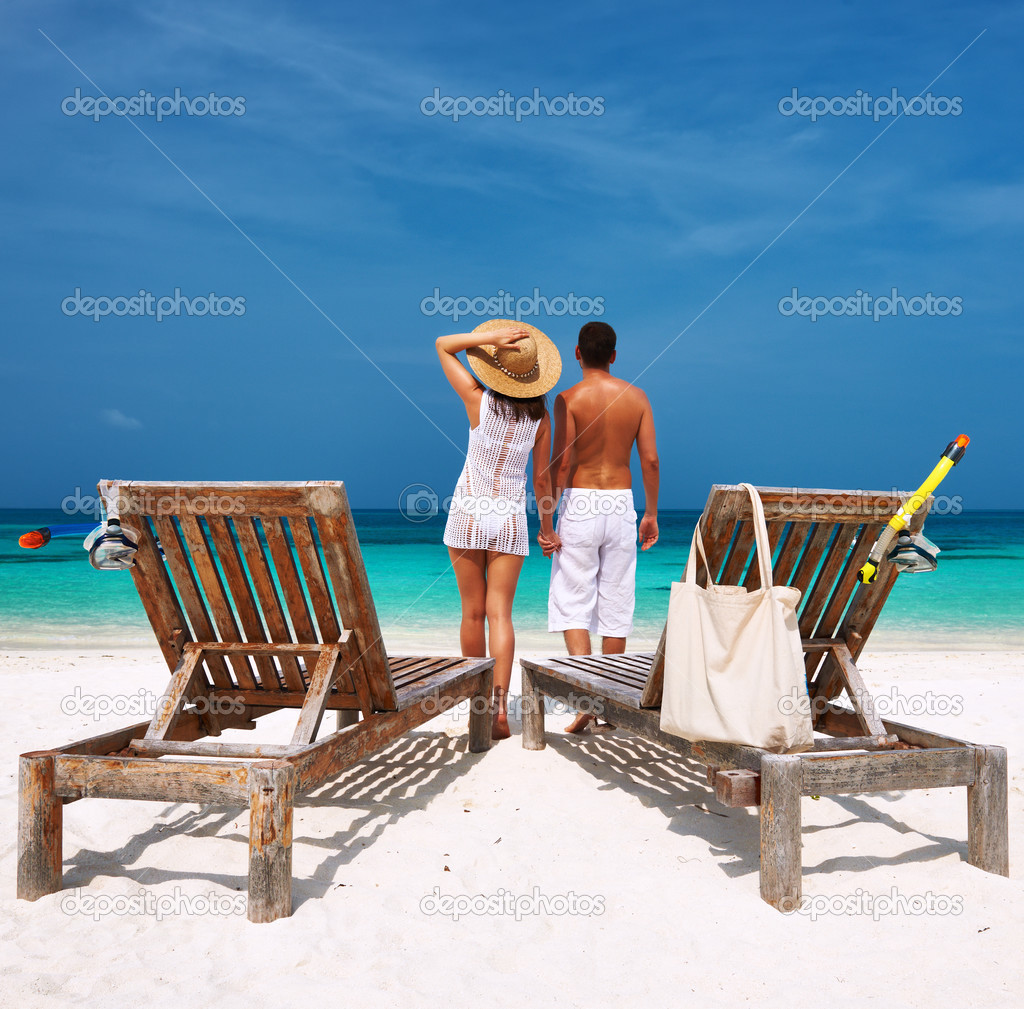 Couple in white on a beach at Maldives