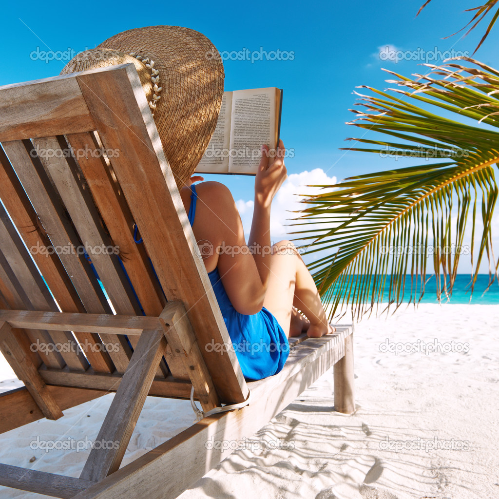Woman reading at beach