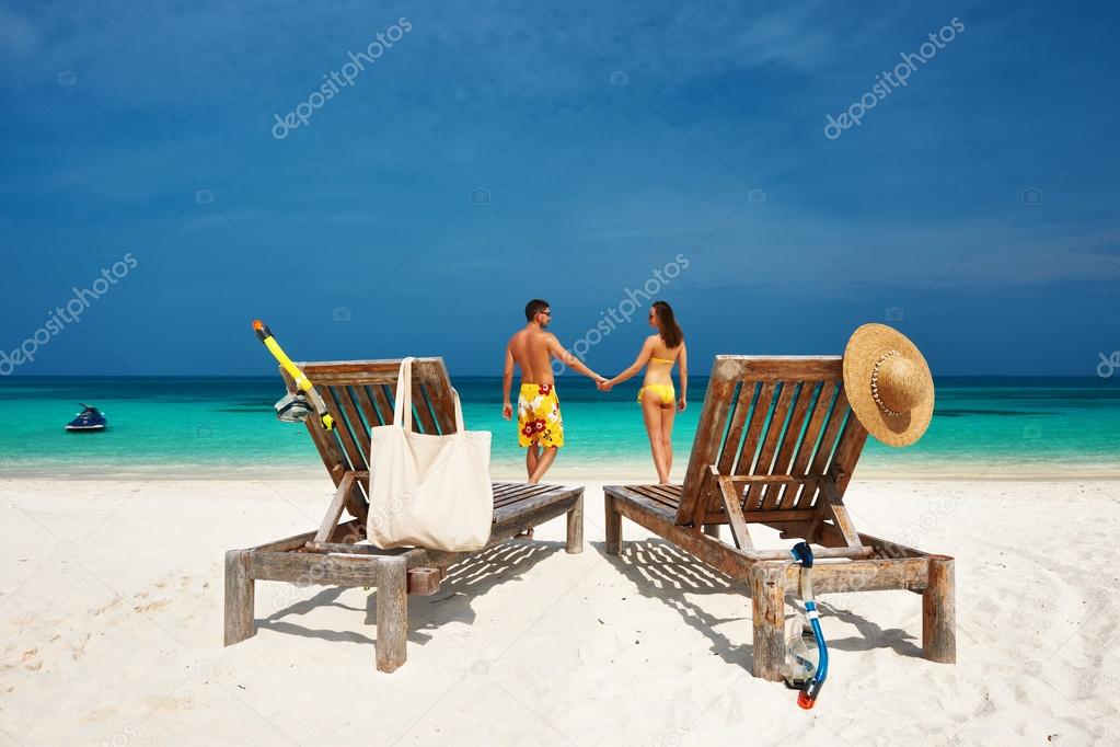 Couple in yellow on a beach at Maldives