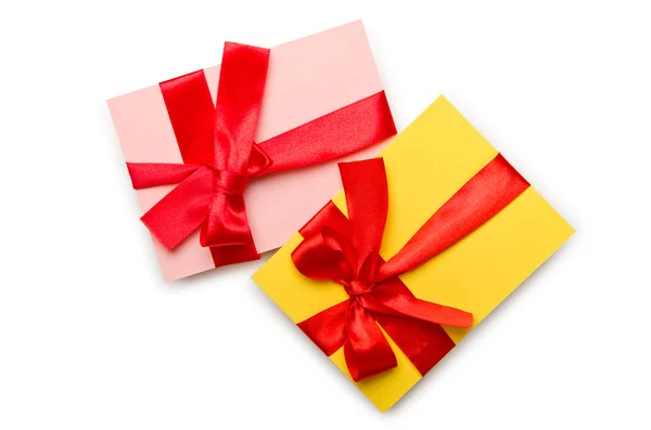 Envelope with colourful ribbon on white — Stock Photo, Image