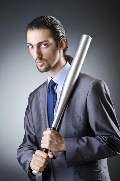 Angry businessman with bat on white — Stock Photo, Image