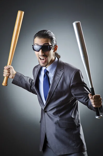 Angry businessman with bat on white — Stock Photo, Image