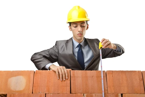 Businessman with bricks on white — Stock Photo, Image