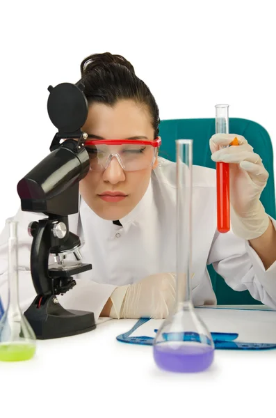 Female chemist in studio on white — Stock Photo, Image