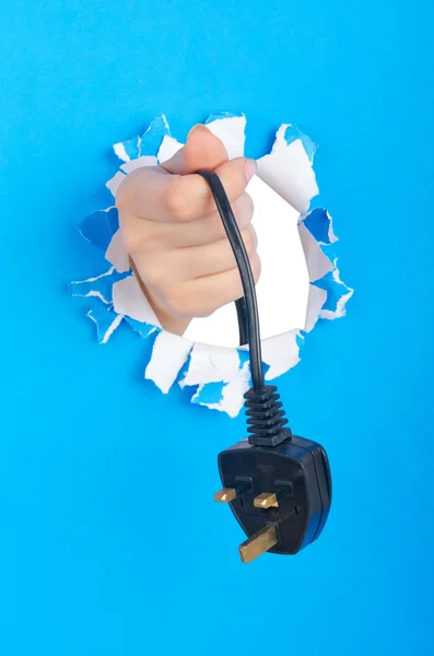 Hand holding electric plug — Stock Photo, Image