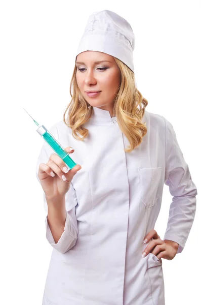 Женщина-врач со шприцем на белом — стоковое фото