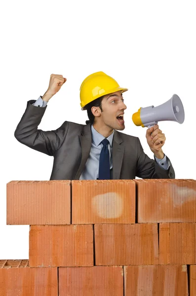 Businessman with bricks on white — Stock Photo, Image