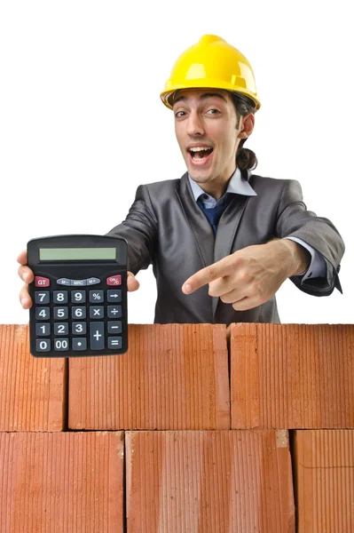 Businessman with bricks on white — Stockfoto