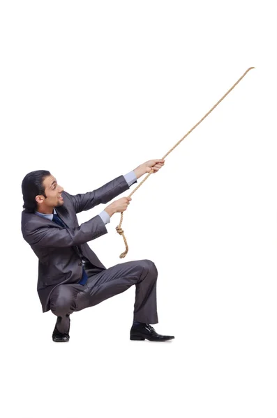 Businessman pulling rope on white — Stock Photo, Image