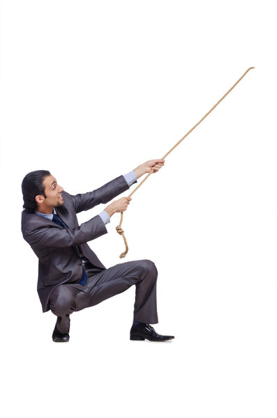 Businessman pulling rope on white