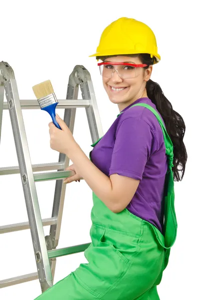 Mujer trabajadora con escalera en blanco — Foto de Stock