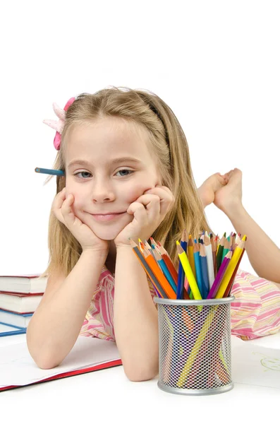 Petite fille écrivant avec des crayons — Photo