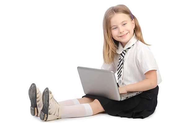 Ragazza carina con computer portatile su bianco — Foto Stock