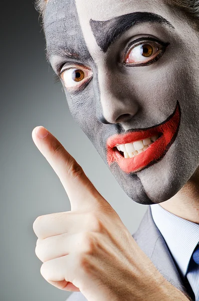 Businessman with clown face paint — Stock Photo, Image