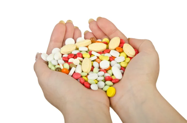 Hands holding pills on white — Stock Photo, Image