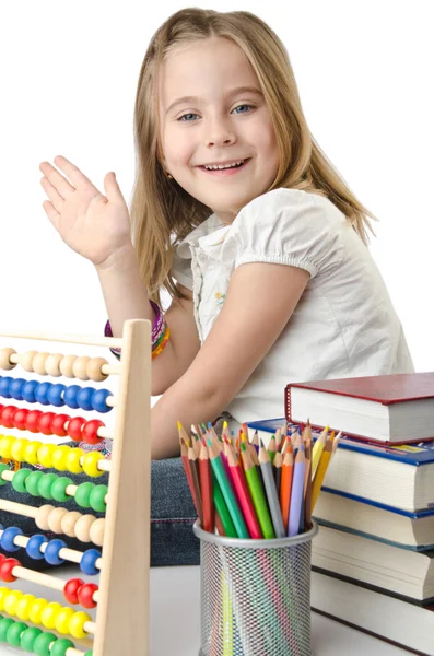 Flicka med böcker och abacus — Stockfoto
