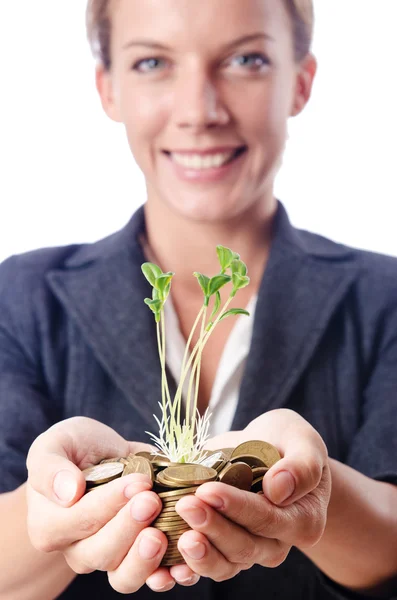 Businesswoman with seedlings and coins — Stock Photo, Image