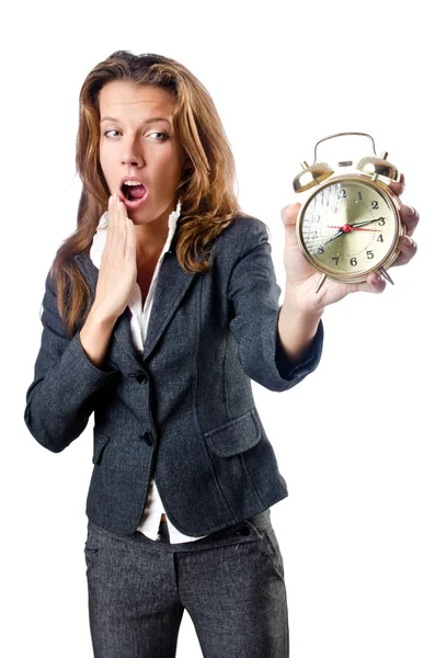 Businesswoman with alarm clock on white — Stock Photo, Image