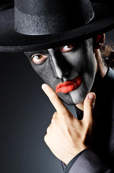 Uomo d'affari con vernice viso clown — Foto Stock