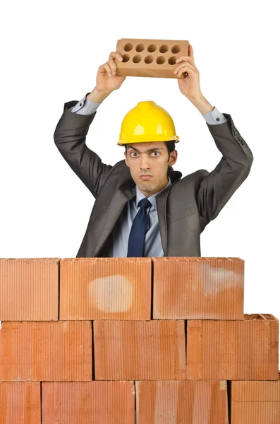Businessman with bricks on white Stock Photo