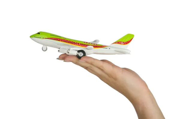 Oyuncak uçak üzerinde beyaz izole tutmak el — Stok fotoğraf