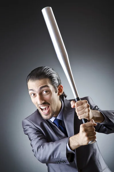 Angry businessman with bat on white — Stock Photo, Image