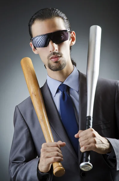 Angry businessman with bat on white — Stock Photo, Image