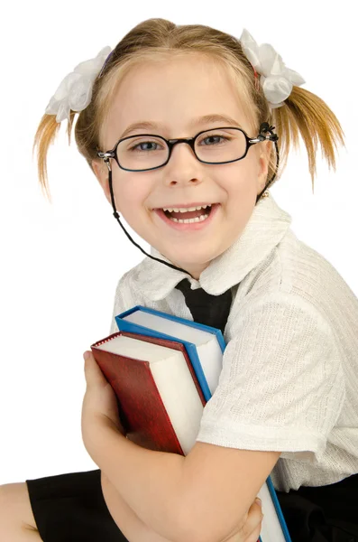 Little girl with books on white — Stock Photo, Image