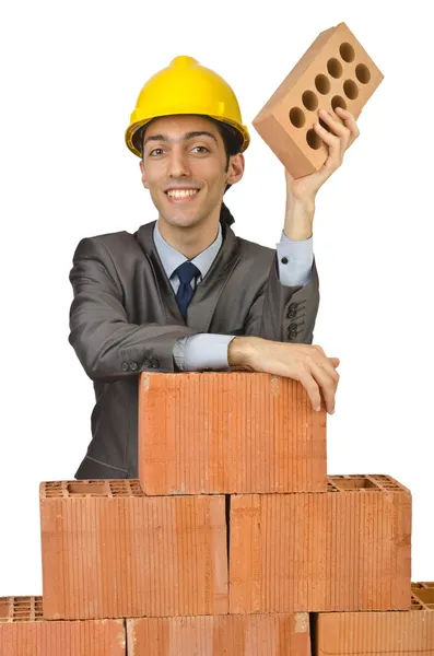 Businessman with bricks on white — Stok fotoğraf