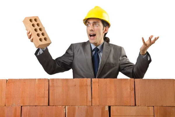 Businessman with bricks on white — Stok fotoğraf