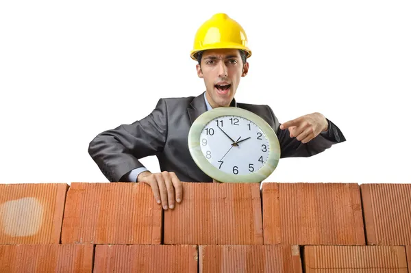 Businessman with bricks on white — Stock Photo, Image