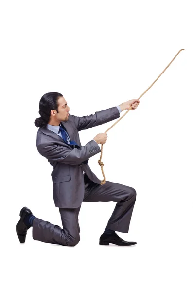 Businessman pulling rope on white — Stock Photo, Image