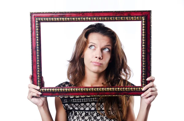 Jonge vrouw met fotolijst op wit — Stockfoto