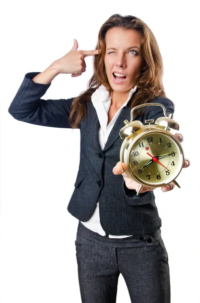 Businesswoman with alarm clock on white — Stock Photo, Image