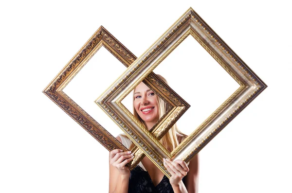 Woman with picture frames on white — Stock Photo, Image