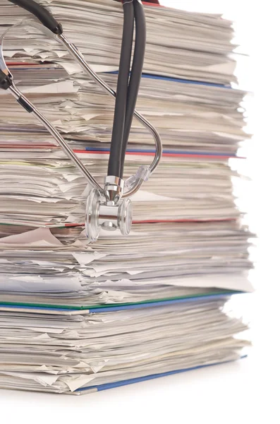 Stack of papers with stethoscope — Stock Photo, Image