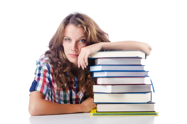 Student mit vielen Büchern auf weiß — Stockfoto