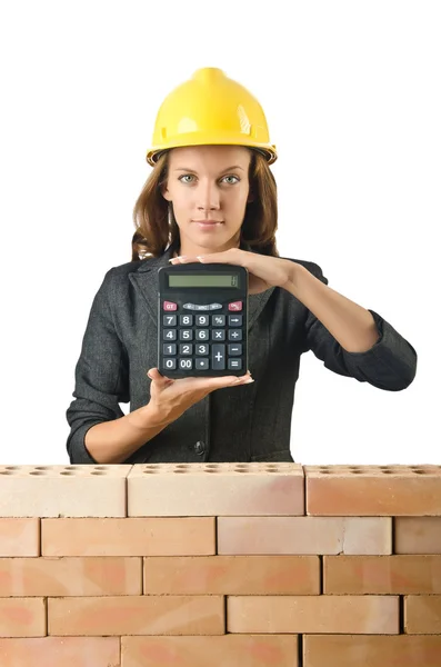 Expensive construction concept with woman — Stock Photo, Image