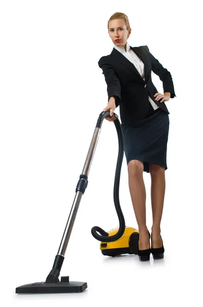 Businesswoman doing vacuum cleaning on white — Stock Photo, Image