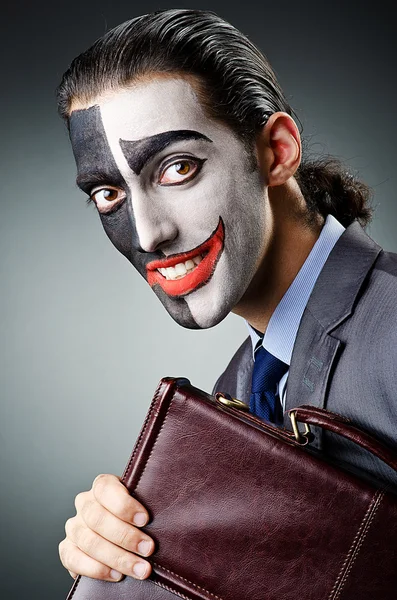 Affärsman med clown ansikte måla — Stockfoto