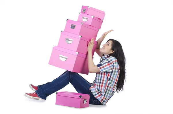 Girl with lots of gifts on white — Stock Photo, Image