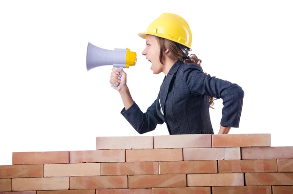 Woman builder with loudspeaker on white — Stock Photo, Image