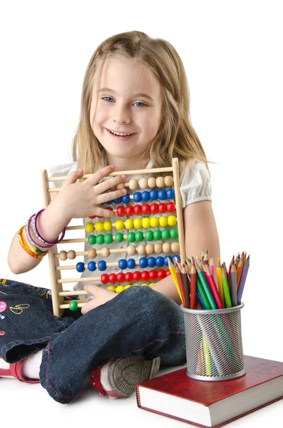 Girl with books and abacus — Stock Photo, Image