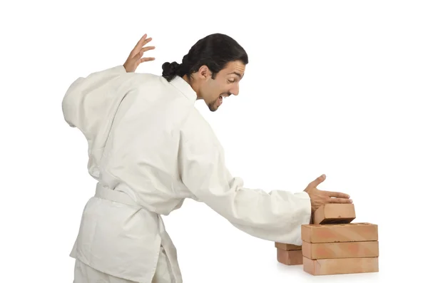 Karate man breaking bricks on white — Stock Photo, Image