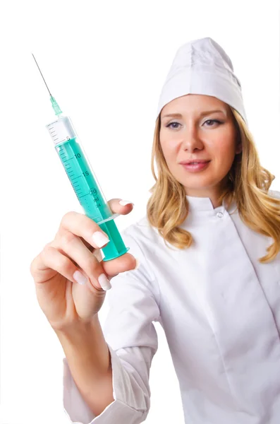 Žena lékař s injekční stříkačkou na bílém — Stock fotografie