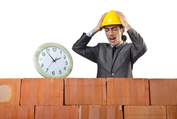 Businessman with bricks on white — Stock Photo, Image