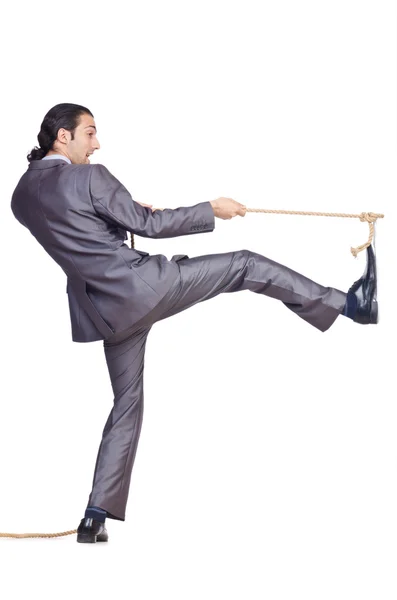 Businessman pulling rope on white — Stock Photo, Image