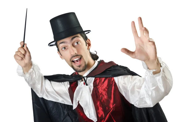 Kouzelník dělá triky na bílém pozadí — Stock fotografie
