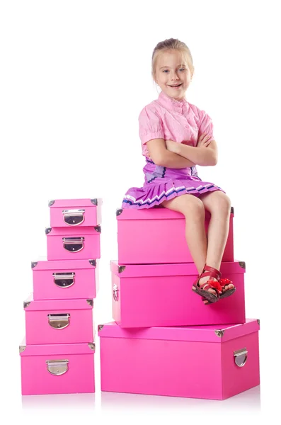 Little cute girl with lots of boxes — Stock Photo, Image