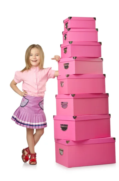 Niña linda con un montón de cajas — Foto de Stock